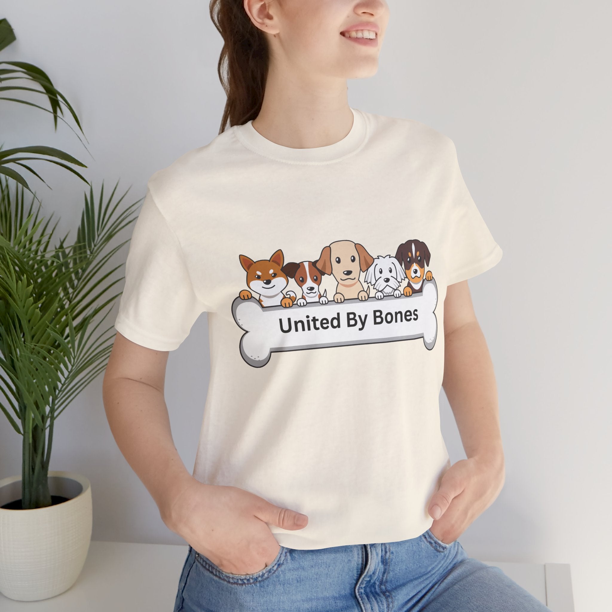 Dog Lover T‑Shirt — "United By Bones" Cute Cartoon Dogs Tee