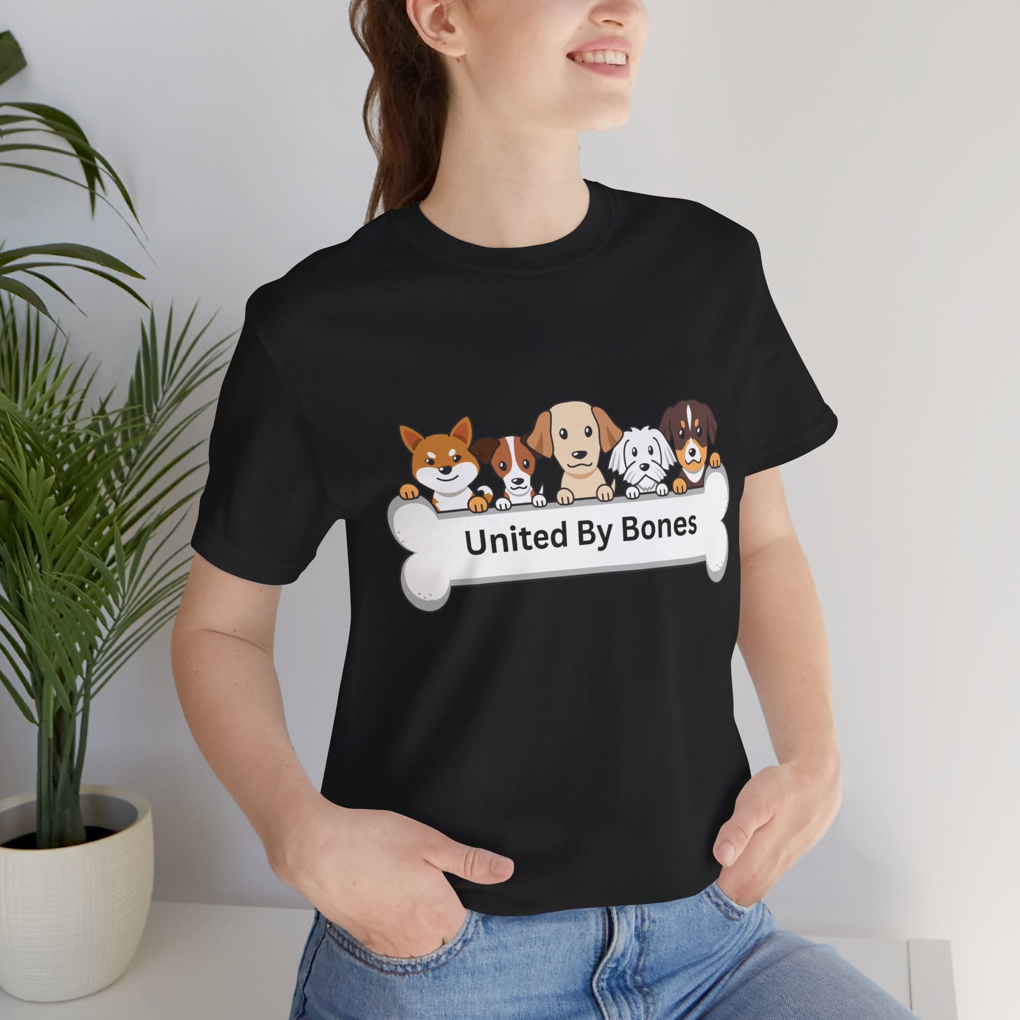 Dog Lover T‑Shirt — "United By Bones" Cute Cartoon Dogs Tee