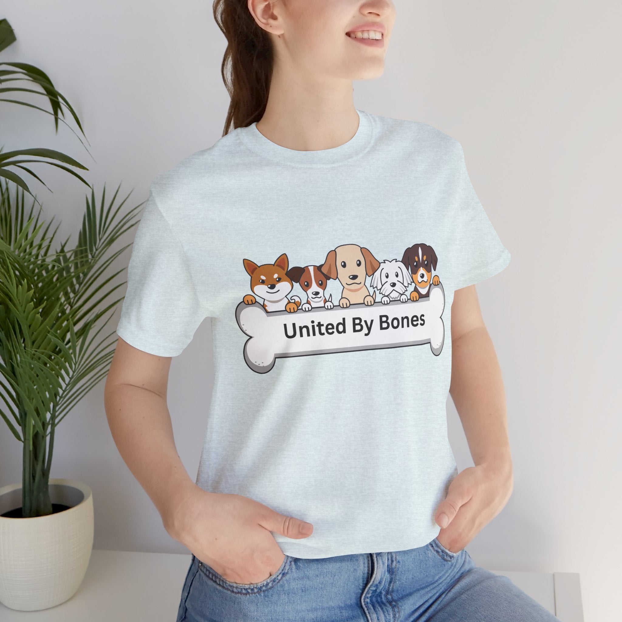 Dog Lover T‑Shirt — "United By Bones" Cute Cartoon Dogs Tee