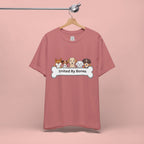 Dog Lover T‑Shirt — "United By Bones" Cute Cartoon Dogs Tee