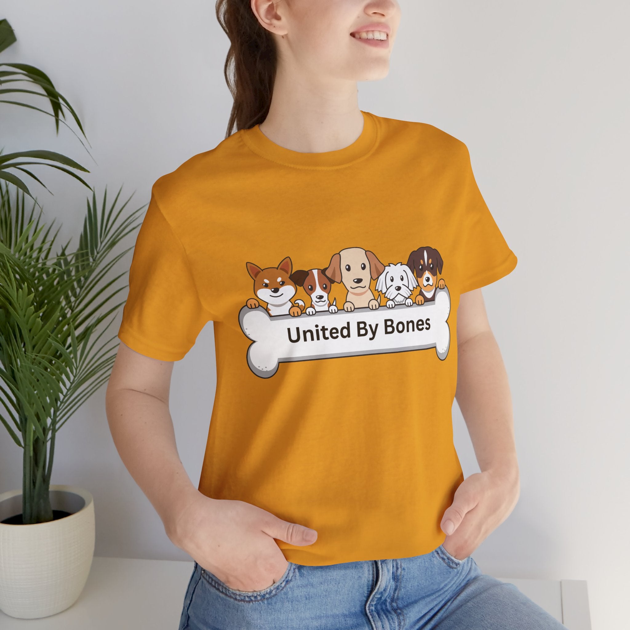 Dog Lover T‑Shirt — "United By Bones" Cute Cartoon Dogs Tee