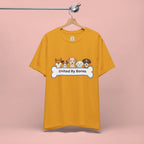 Dog Lover T‑Shirt — "United By Bones" Cute Cartoon Dogs Tee